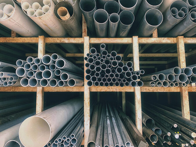 PVC pipes on a rack iin a plumning supply wholesaler