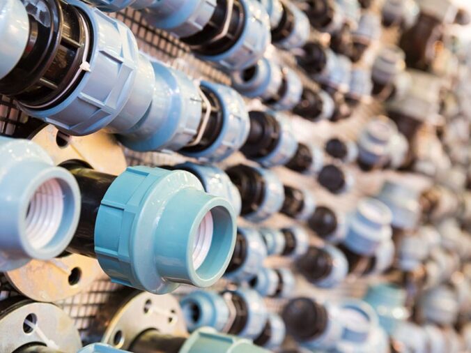 PVC unions on display in a plumning supply wholesaler