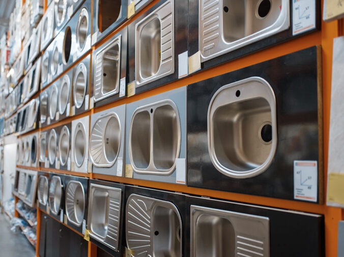 Kitchen sinks on display in a plumning supply wholesaler